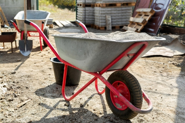 A short load concrete service with a Wheelbarrow filled with the perfect amount of concrete for a construction project